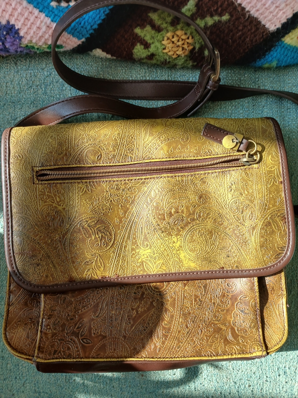 Relic Embossed Leather Crossbody Bag in Gold